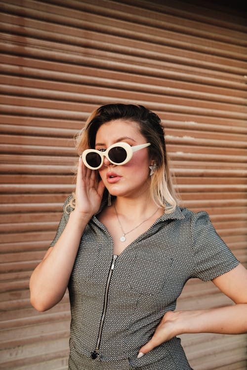 Free A woman in sunglasses and a dress Stock Photo