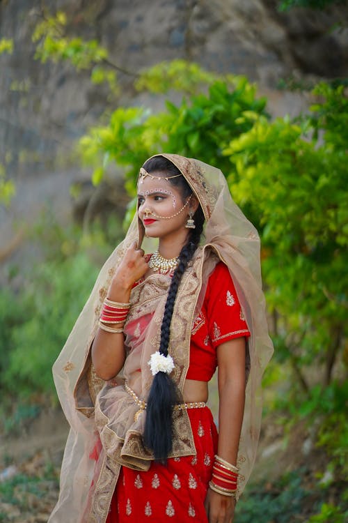 A woman in traditional indian clothing posing for a photo