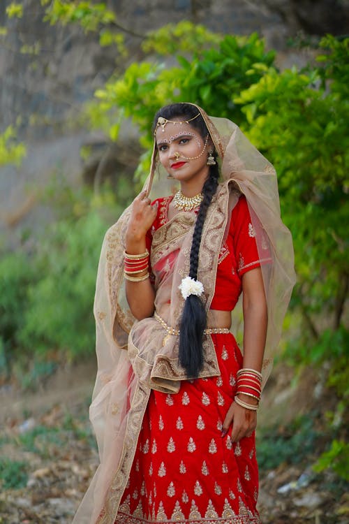 A woman in traditional indian clothing posing for a photo