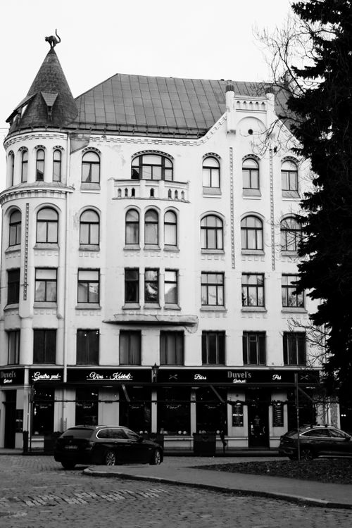 Free Elegant facade of a historic building in Riga, Latvia captured in a classic black and white style. Stock Photo