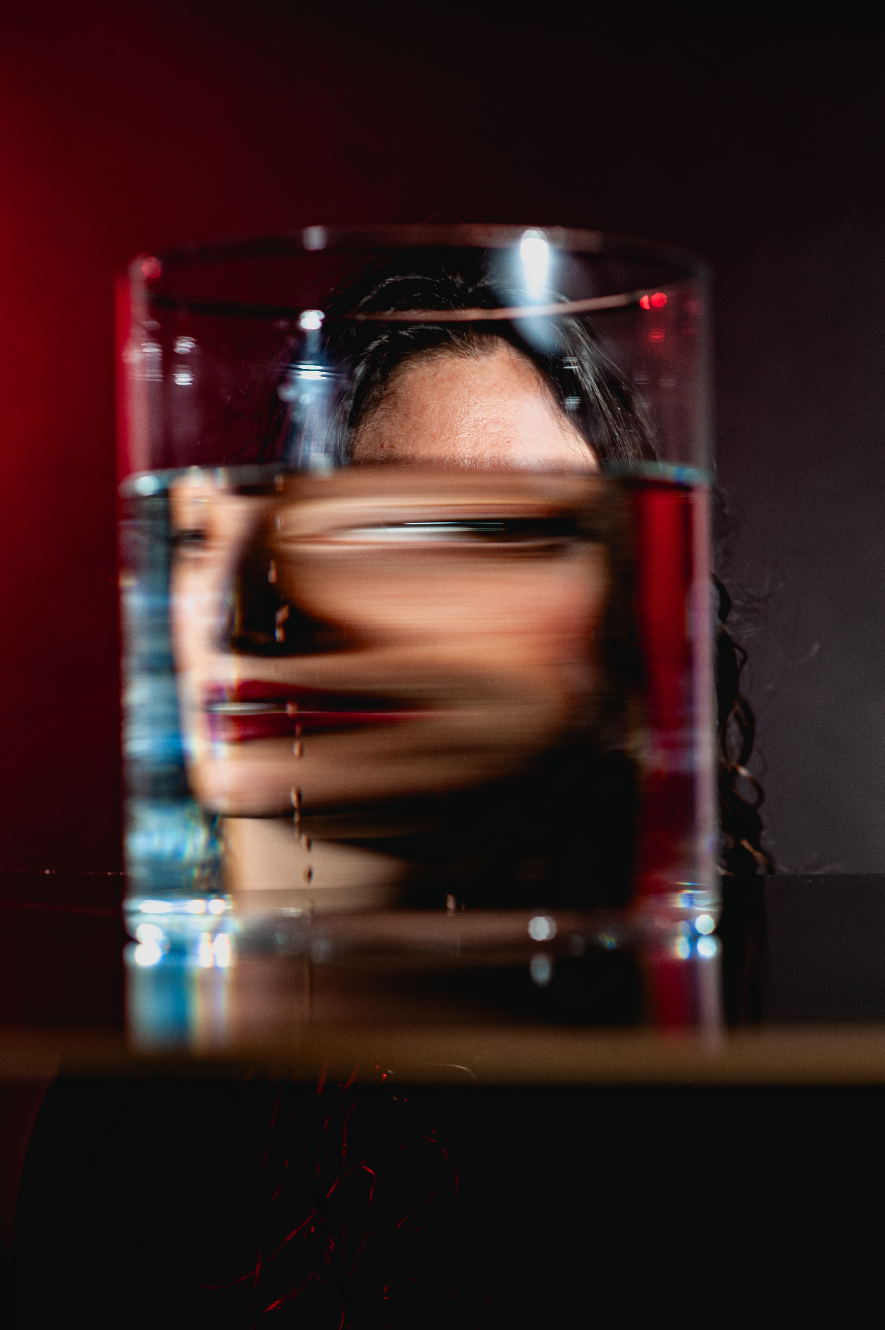 Blurred Woman Face in Liquid in Glass · Free Stock Photo