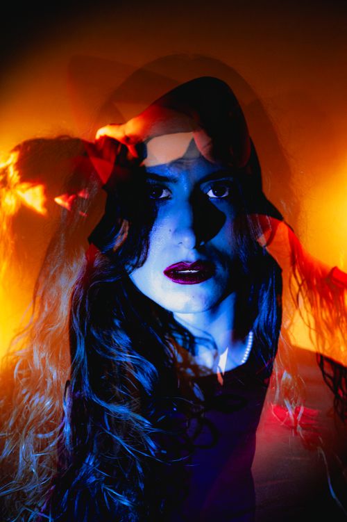 Free Stunning artistic double exposure portrait of a woman with a dynamic, colorful contrast effect. Stock Photo