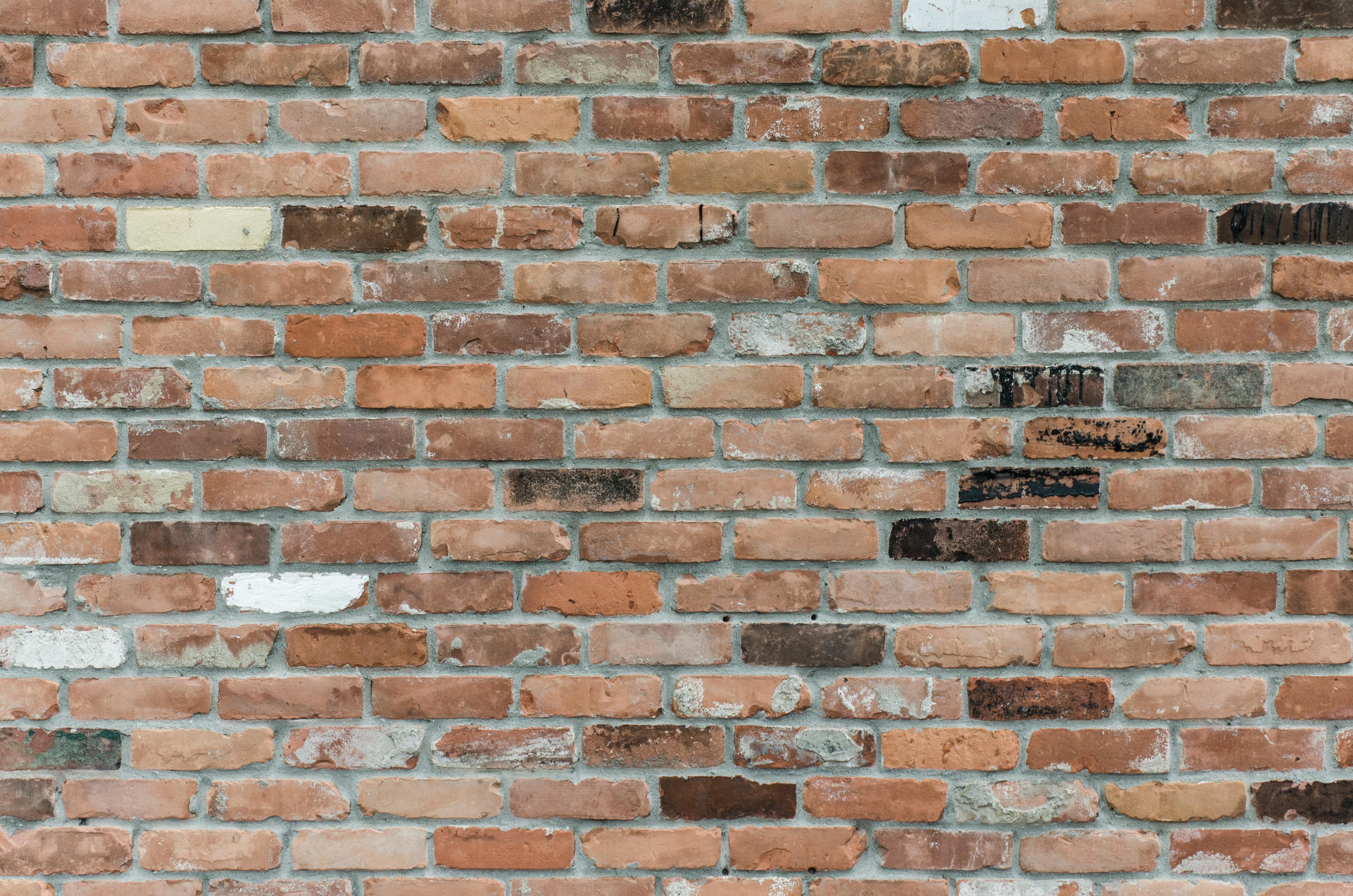 Brown Brick Wall Close Up Photography · Free Stock Photo