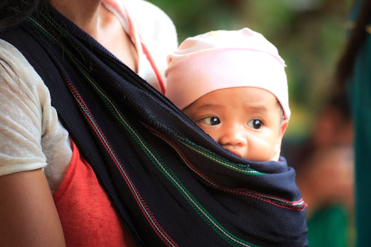 Woman Carrying Baby