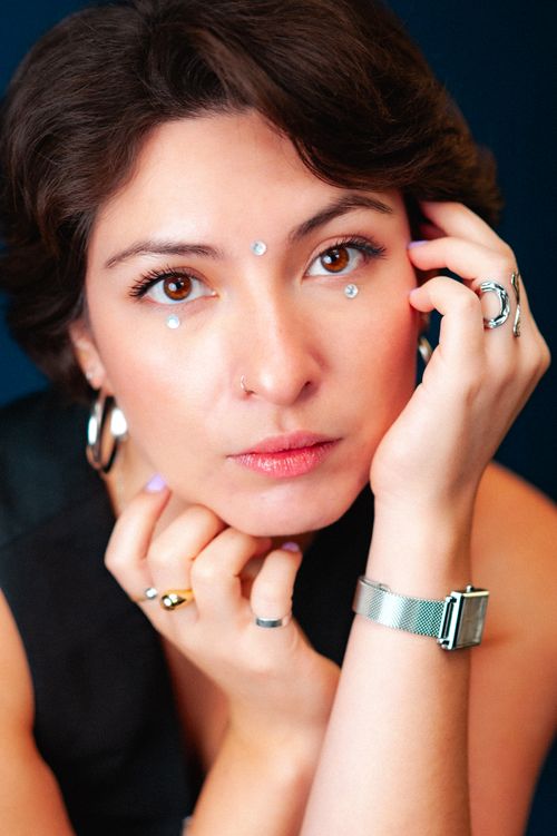 Free Stunning portrait of a woman adorned with accessories, reflecting beauty and style. Stock Photo