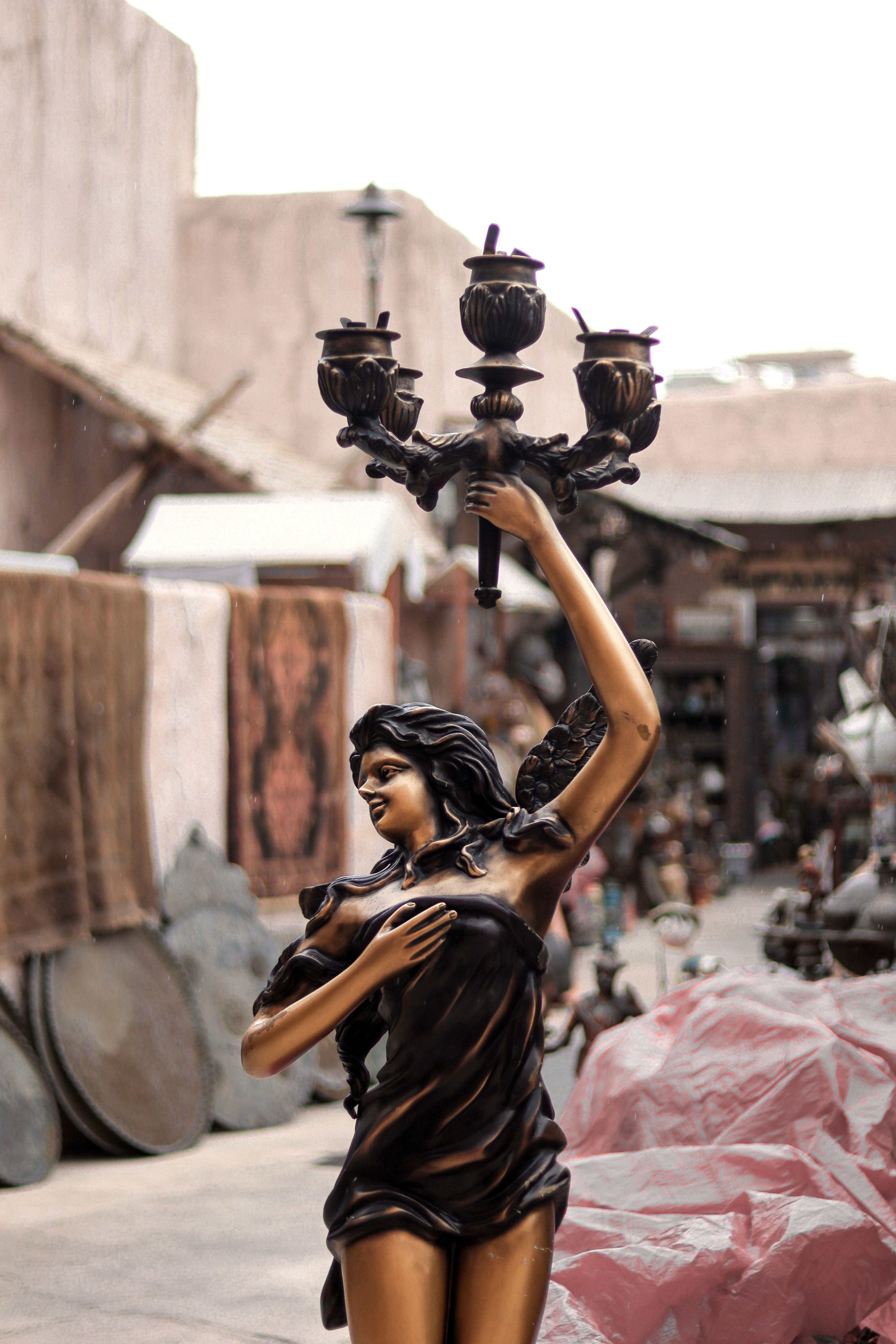Statue of Girl Holding Lanterns · Free Stock Photo