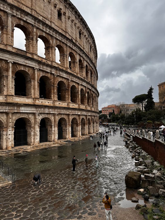 People Walking near Colosseum in Rain · Free Stock Photo