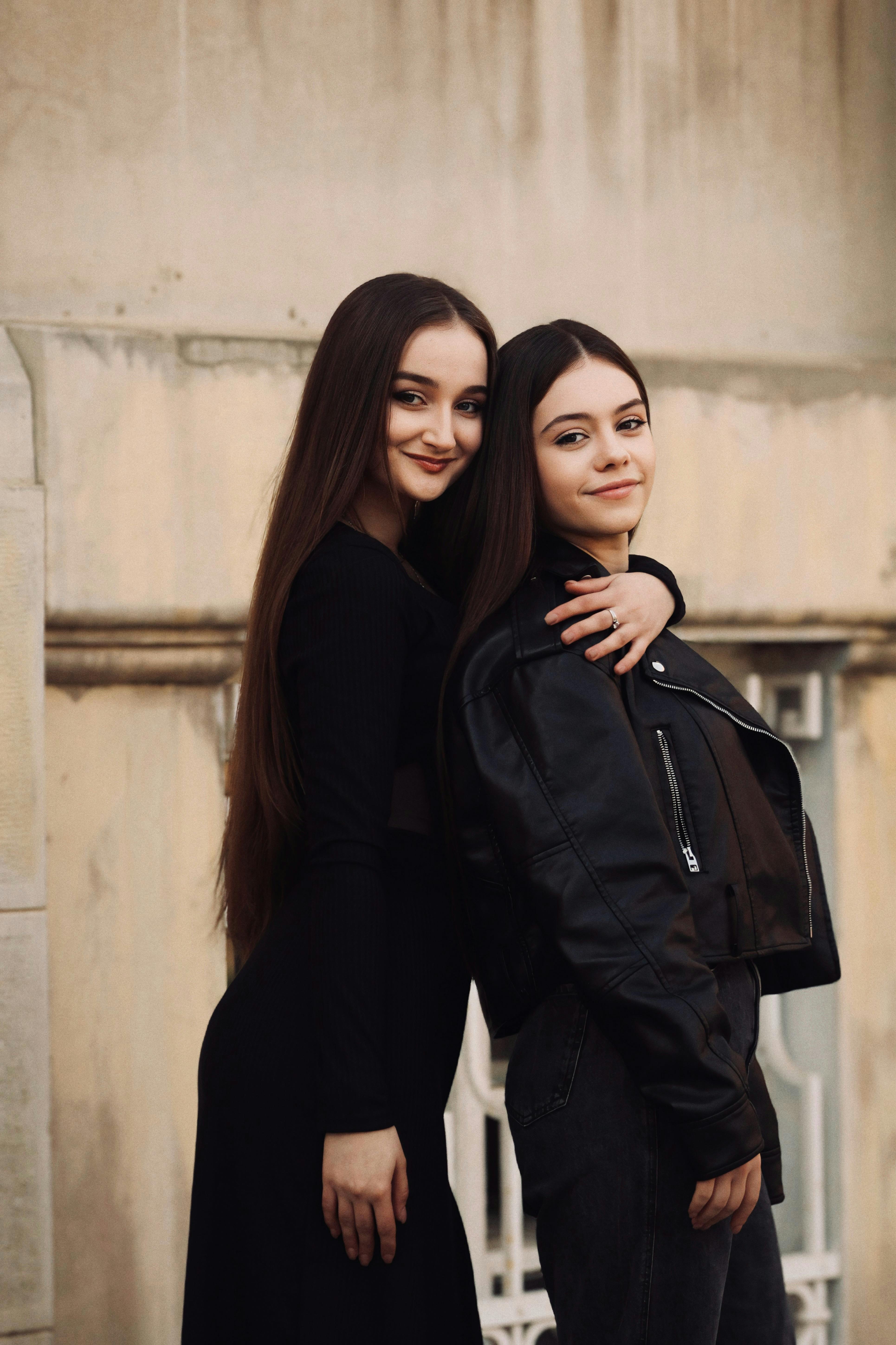 Beautiful Brunette Women Posing Together · Free Stock Photo