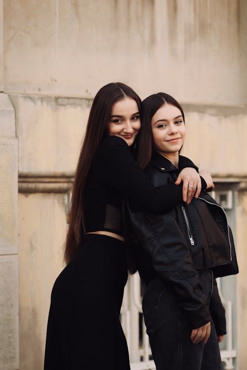 Free Happy Women Posing Together on Street Stock Photo