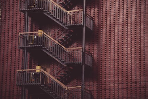 Brown Stairs Beside Building