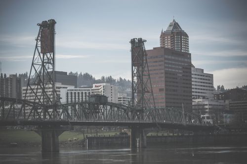 Free Foggy view of Portland skyscrapers and the iconic Steel Bridge across the Willamette River. Stock Photo