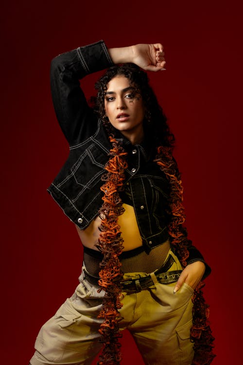 Portrait of Brunette Woman in Jacket and Flowers Garland