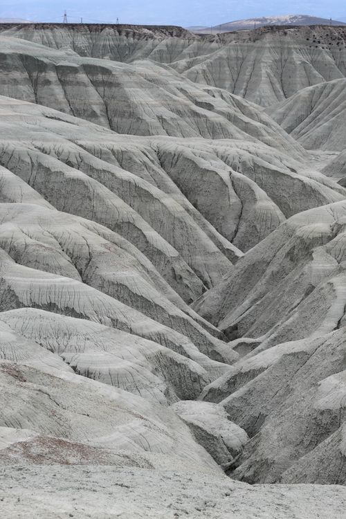 Free Stunning aerial view captures intricate erosion patterns in a barren, rugged landscape. Stock Photo