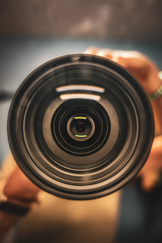 Detailed macro view of a camera lens focusing mechanism.