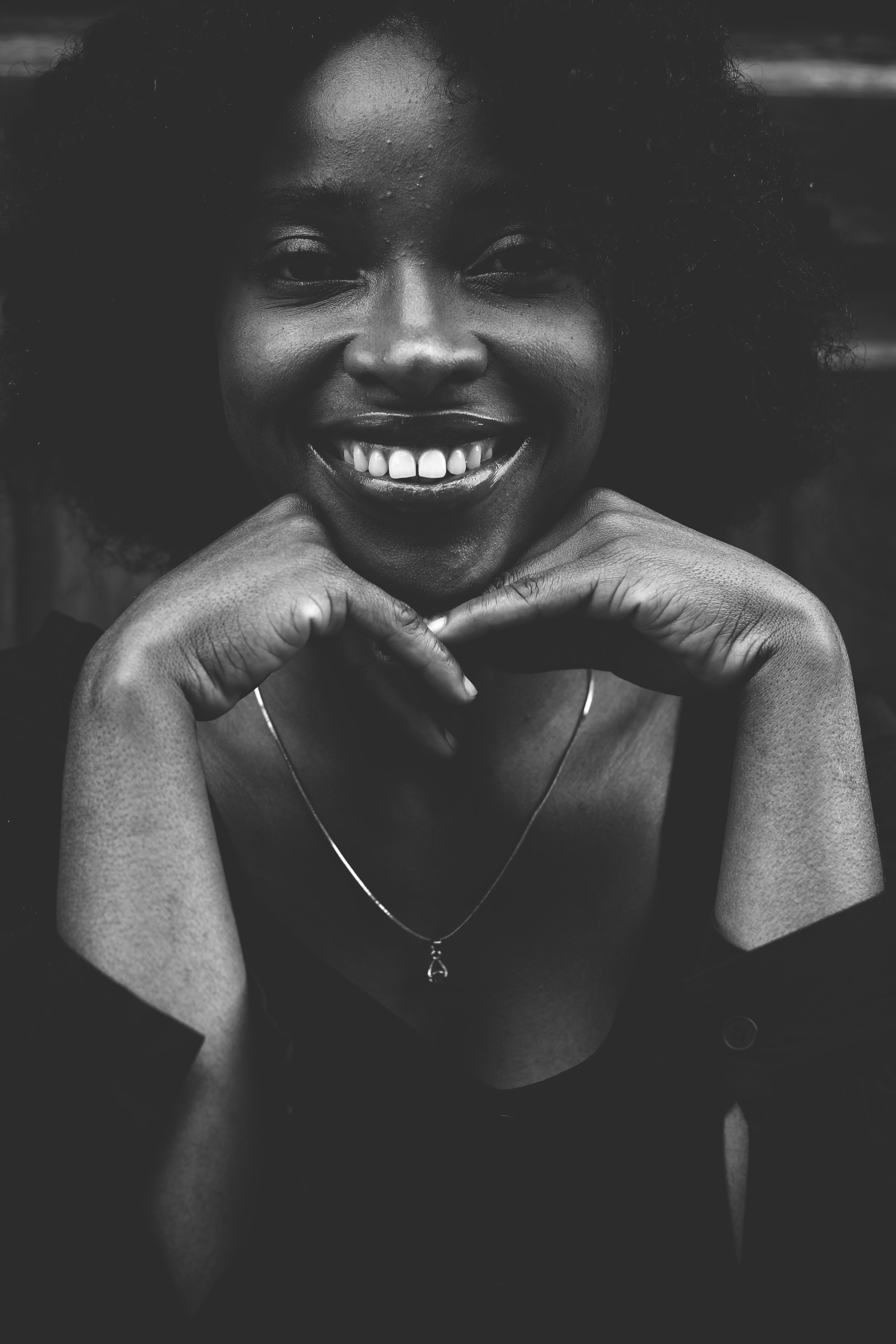 Portrait of Smiling Woman in Black and White · Free Stock Photo