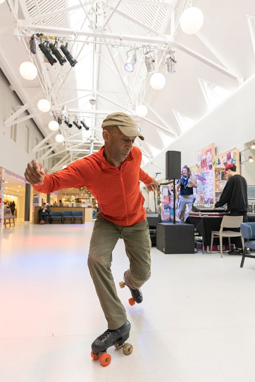 A man on a skateboard in a large indoor space