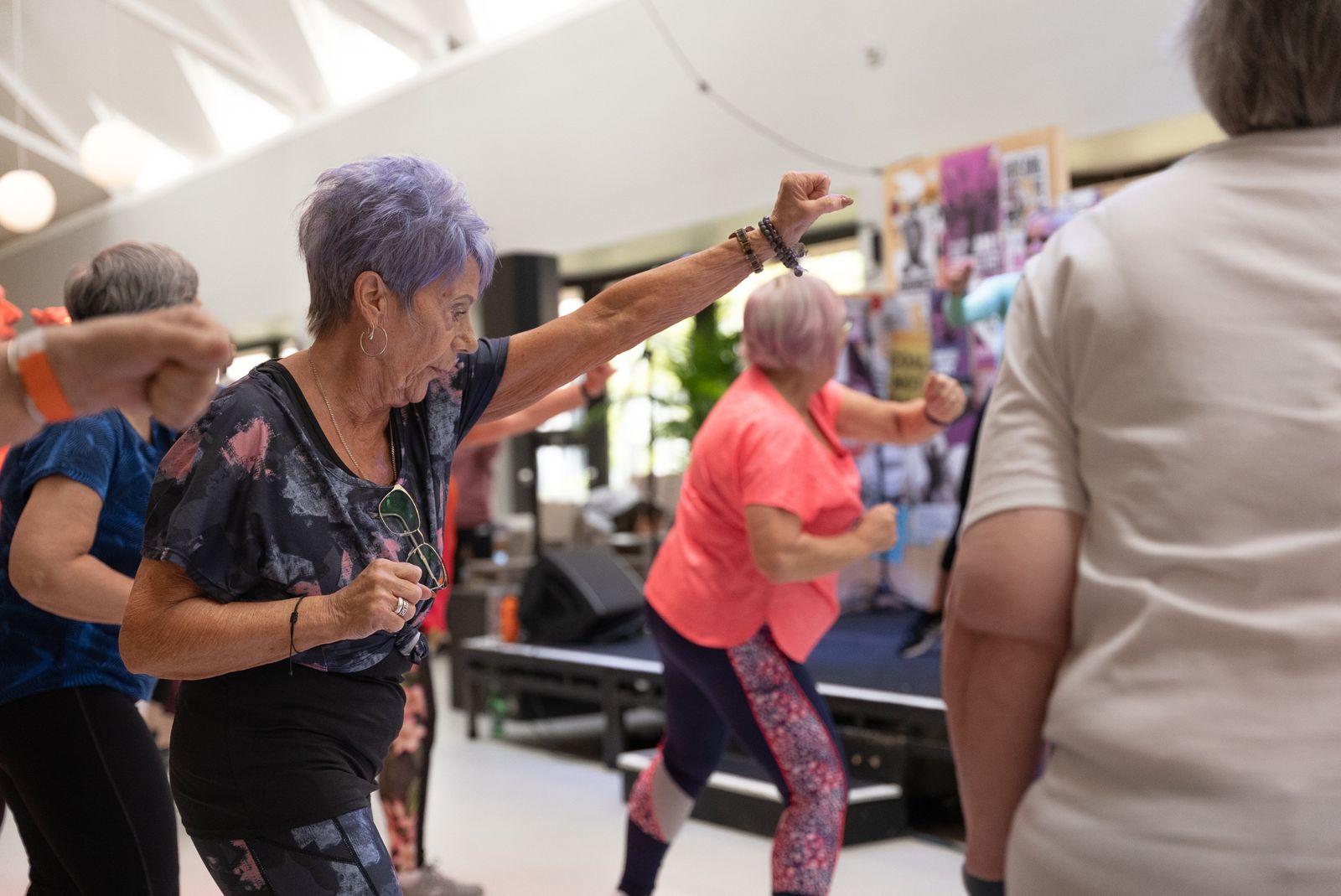 Dancers moving to Latin music in a lively Zumba class setting