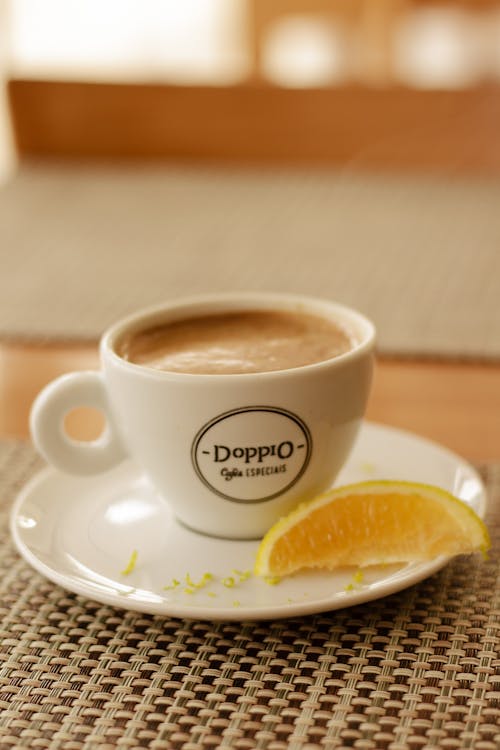 Free A cup of coffee with a slice of lemon on top Stock Photo