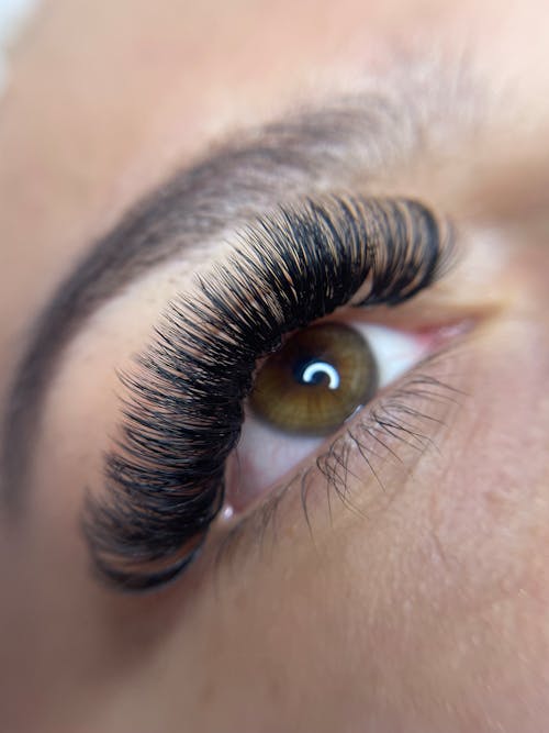 A woman's eye with long lashes and long eyelashes