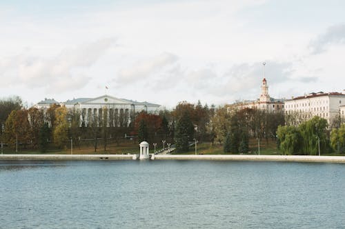 A lake with a building in the background