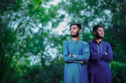 Two Asian Muslim boys are standing.