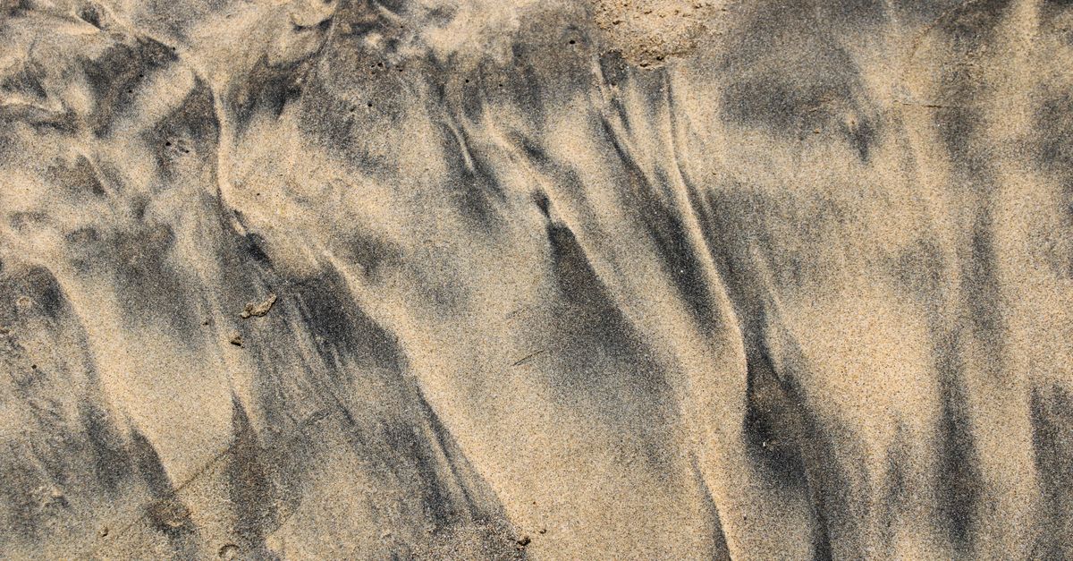 Real Sand Patterns Textured Sand with Natural Patterns at Beach · Free Stock Photo