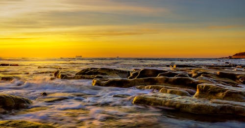 Free Rocks by the Sea During Sunset  Stock Photo