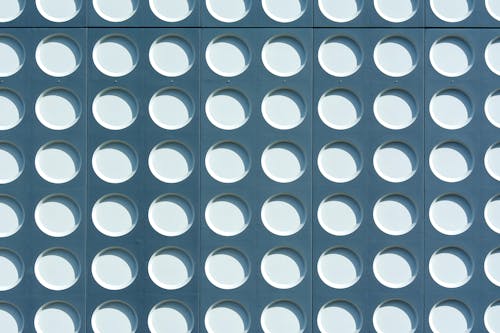 A close up of a patterned wall with circles
