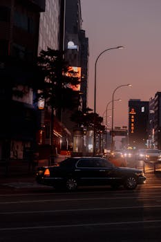 A city street at dusk with glowing lights and vivid urban atmosphere.