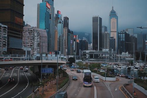 Free A city street with cars and buses driving down it Stock Photo