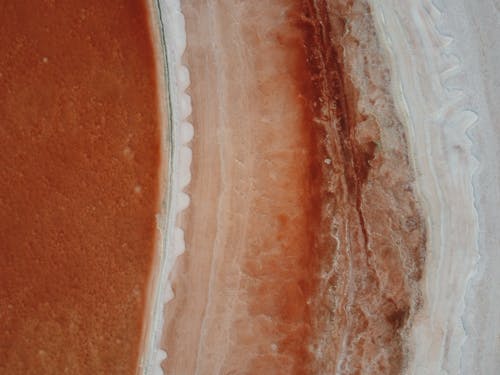 A close up of a red and white rock