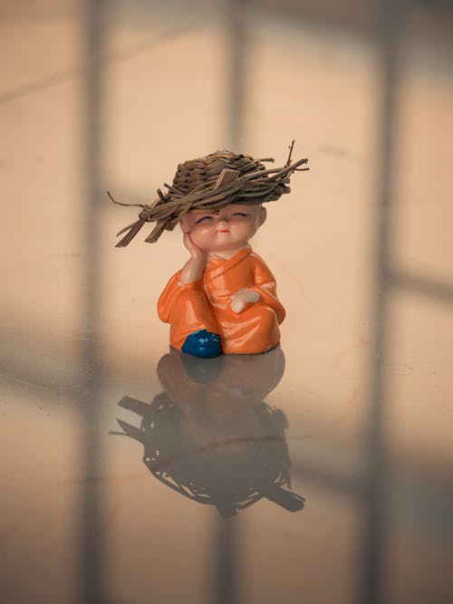 Free A small figurine with a straw hat on Stock Photo