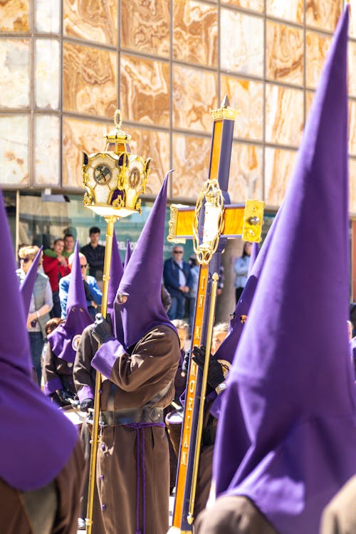 Free A group of people dressed in purple robes and hats Stock Photo