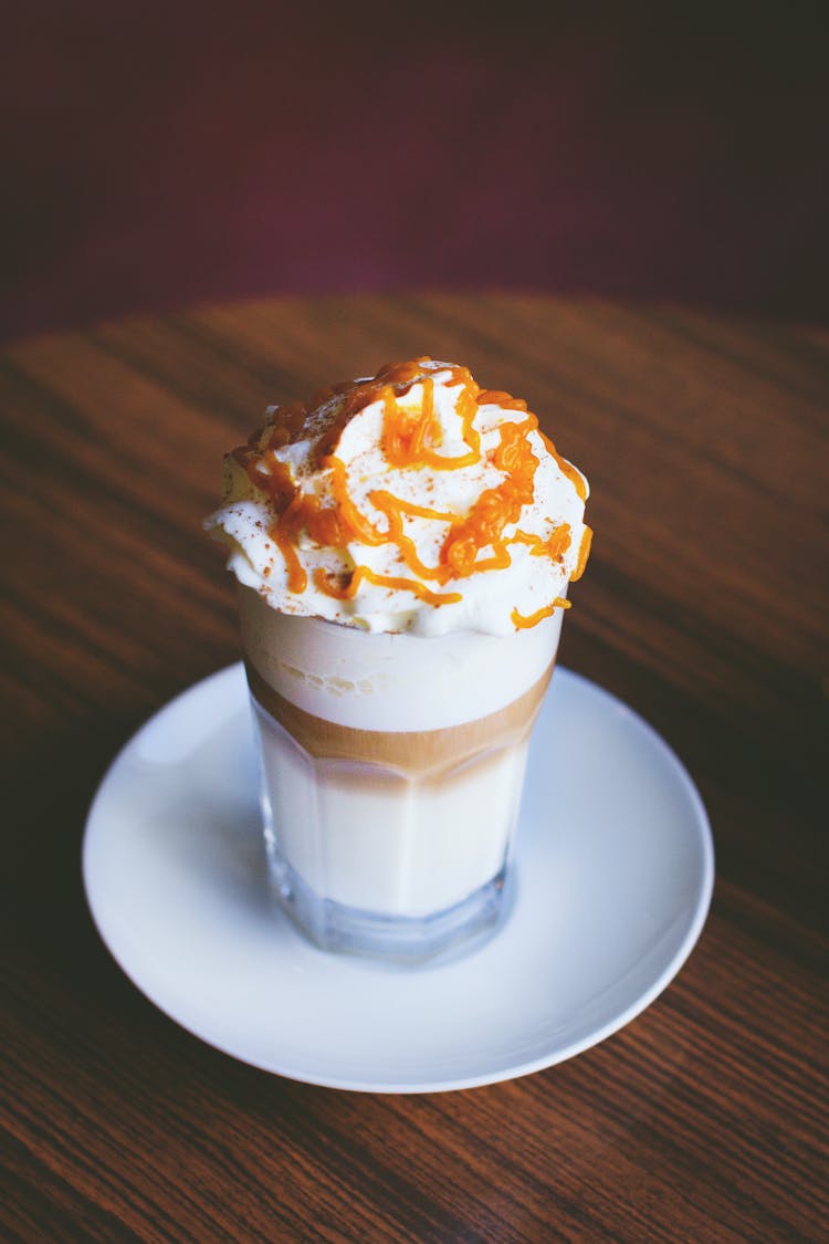 White And Brown Caramel Frappe On Clear Drinking Glass