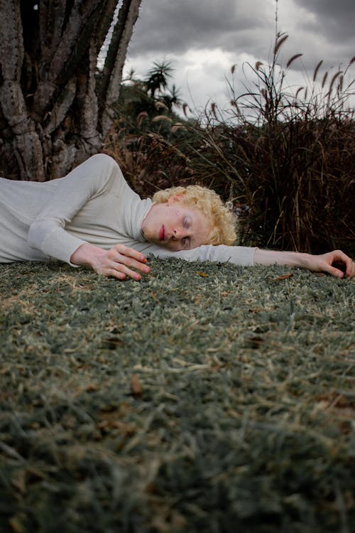 Free Photo Of Man Laying On The Ground Stock Photo