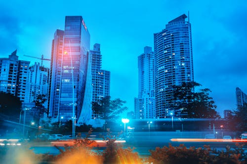 Photo Of Buildings Under Cloudy Skies