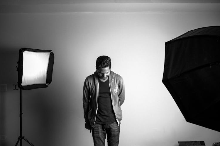 Grayscale Photography Of Standing Man In Studio