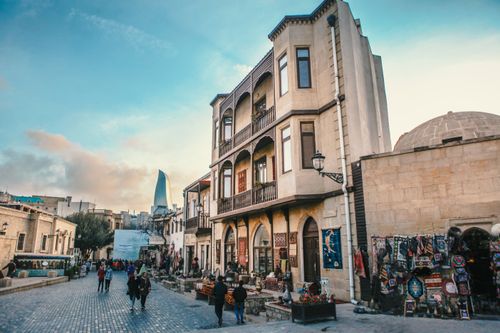 Free Explore the bustling historic streets of Baku with vibrant shops and iconic architecture. Stock Photo