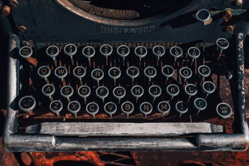 Free Close-up of vintage typewriter keys with retro aesthetic and detailed buttons. Ideal for nostalgic themes. Stock Photo