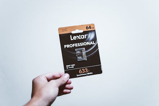 A hand holding a packaged 64GB Lexar Professional SD card, ideal for digital storage.