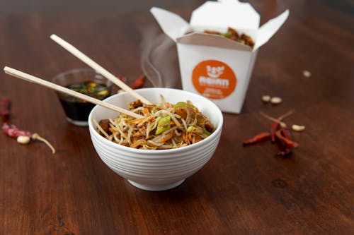 Free A bowl of noodles with chopsticks and chopsticks Stock Photo