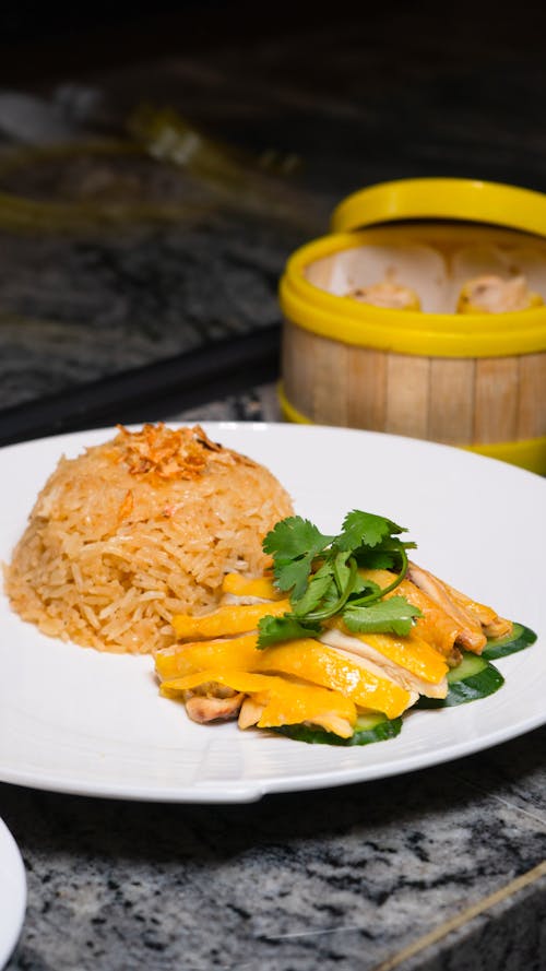 Free A plate of food with rice and a bowl of food Stock Photo