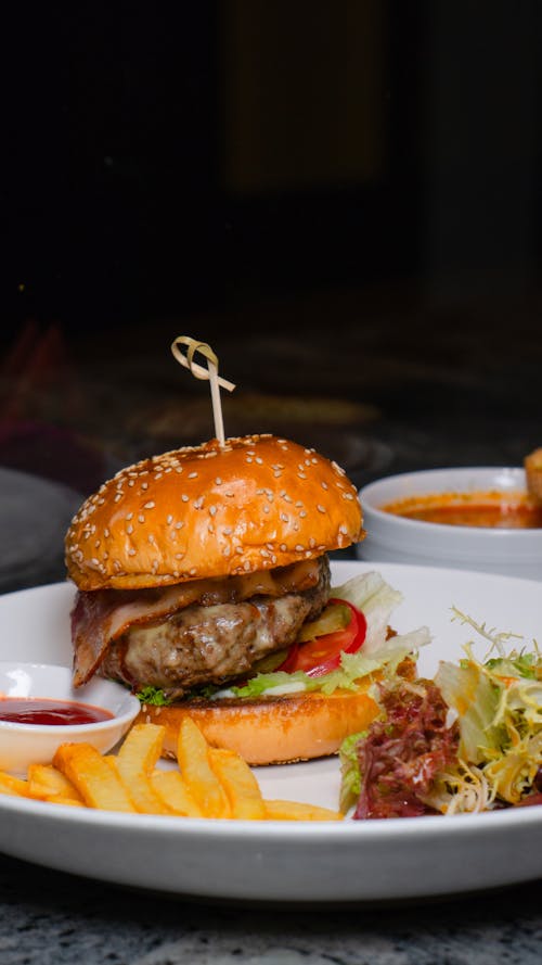 Free Hamburger with Chips on a Plate  Stock Photo