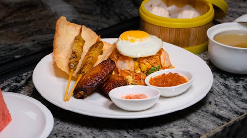 Free A plate of food with a bowl of water and a plate of food Stock Photo