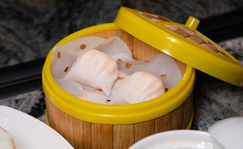 A bowl of dumplings and a cup of tea