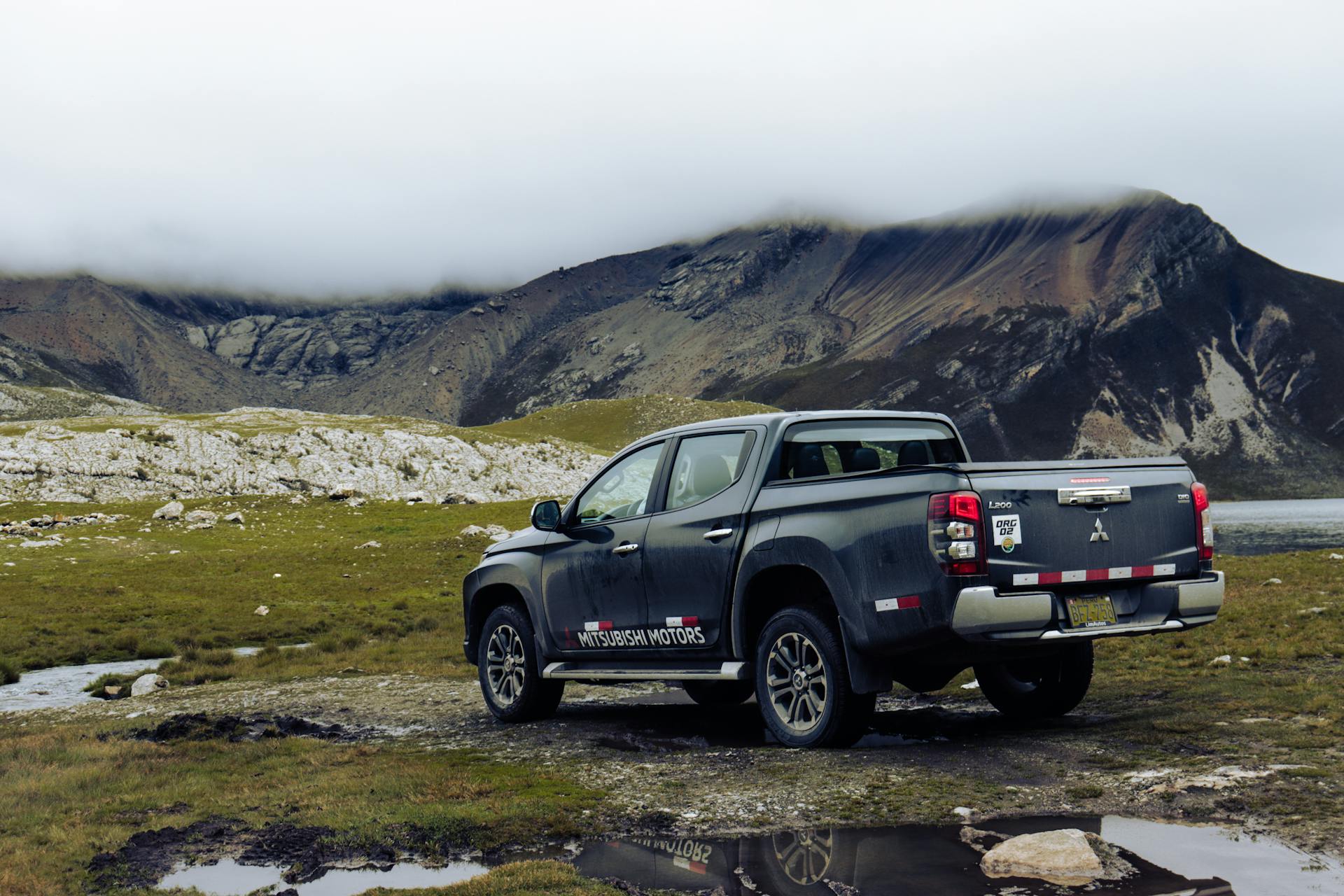 Mitsubishi Triton Pick-up Truck with Scenic Mountains in the Background