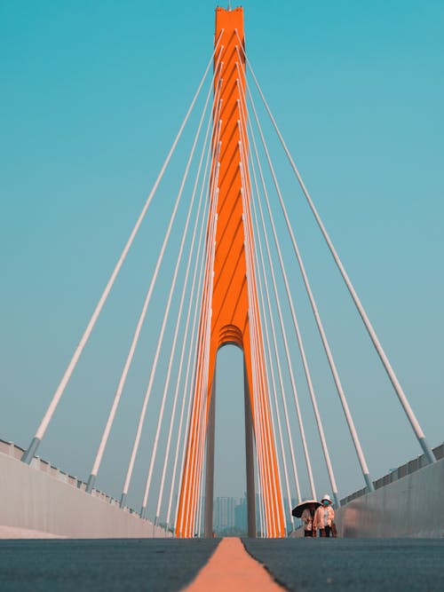 Free A person is walking on a bridge with a white background Stock Photo