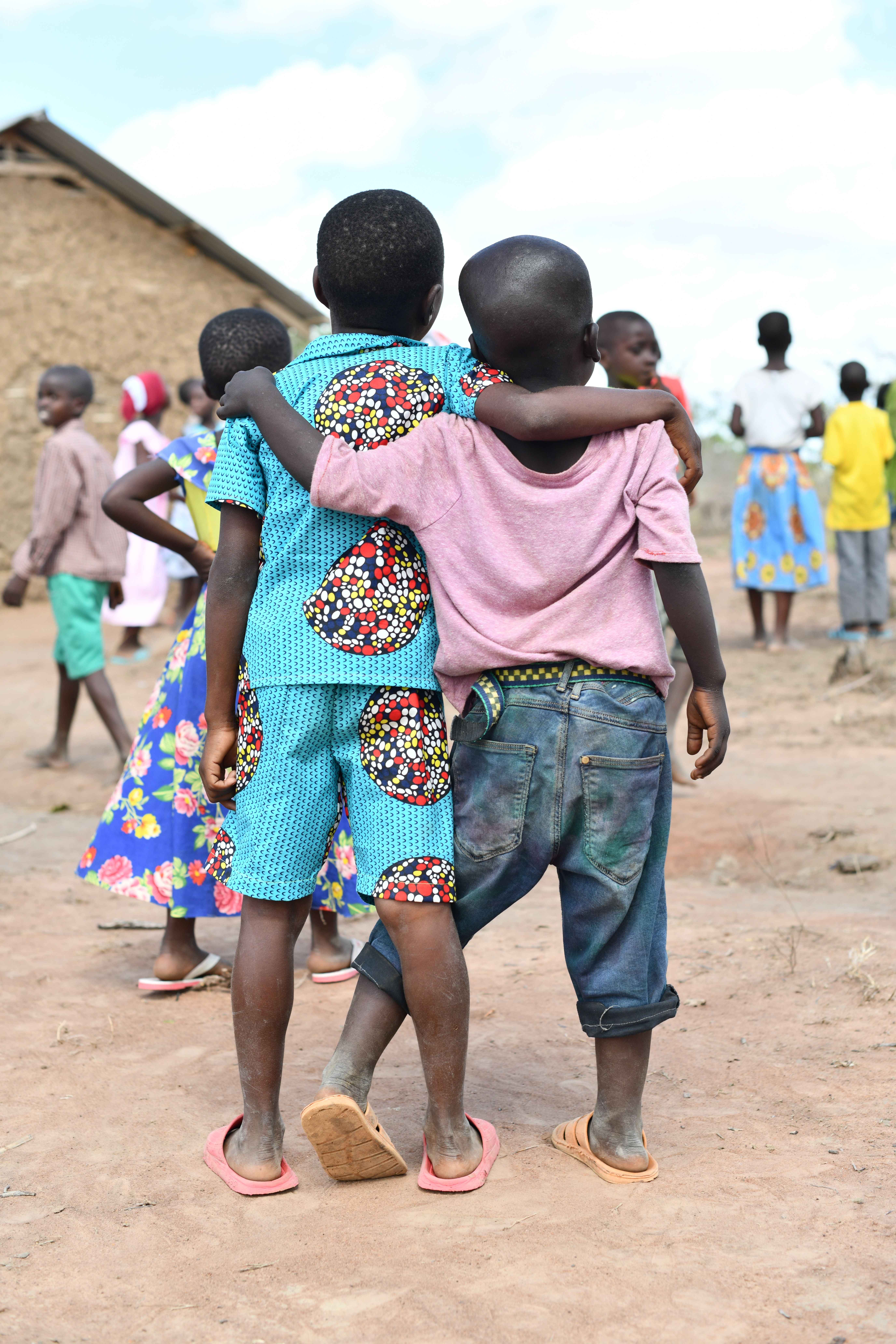 Back View of Boys Standing with their Arms around Each Other · Free ...