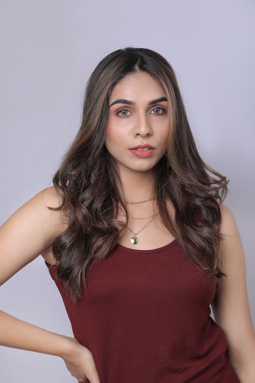 Portrait of Brunette Woman Wearing Burgundy Dress 