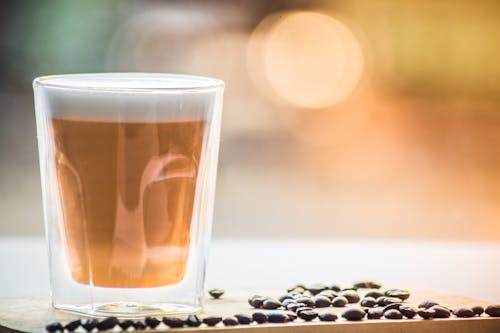 Free Coffee in Drinking Glass With Black Beans Stock Photo